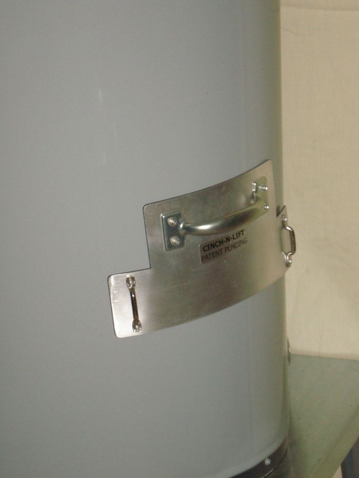 The handle plate held on the tank by its magnets