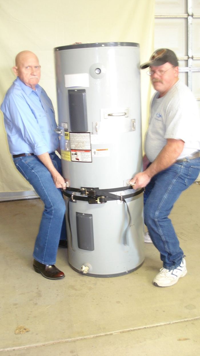 Two men lifting a water heater with a straight-back squat